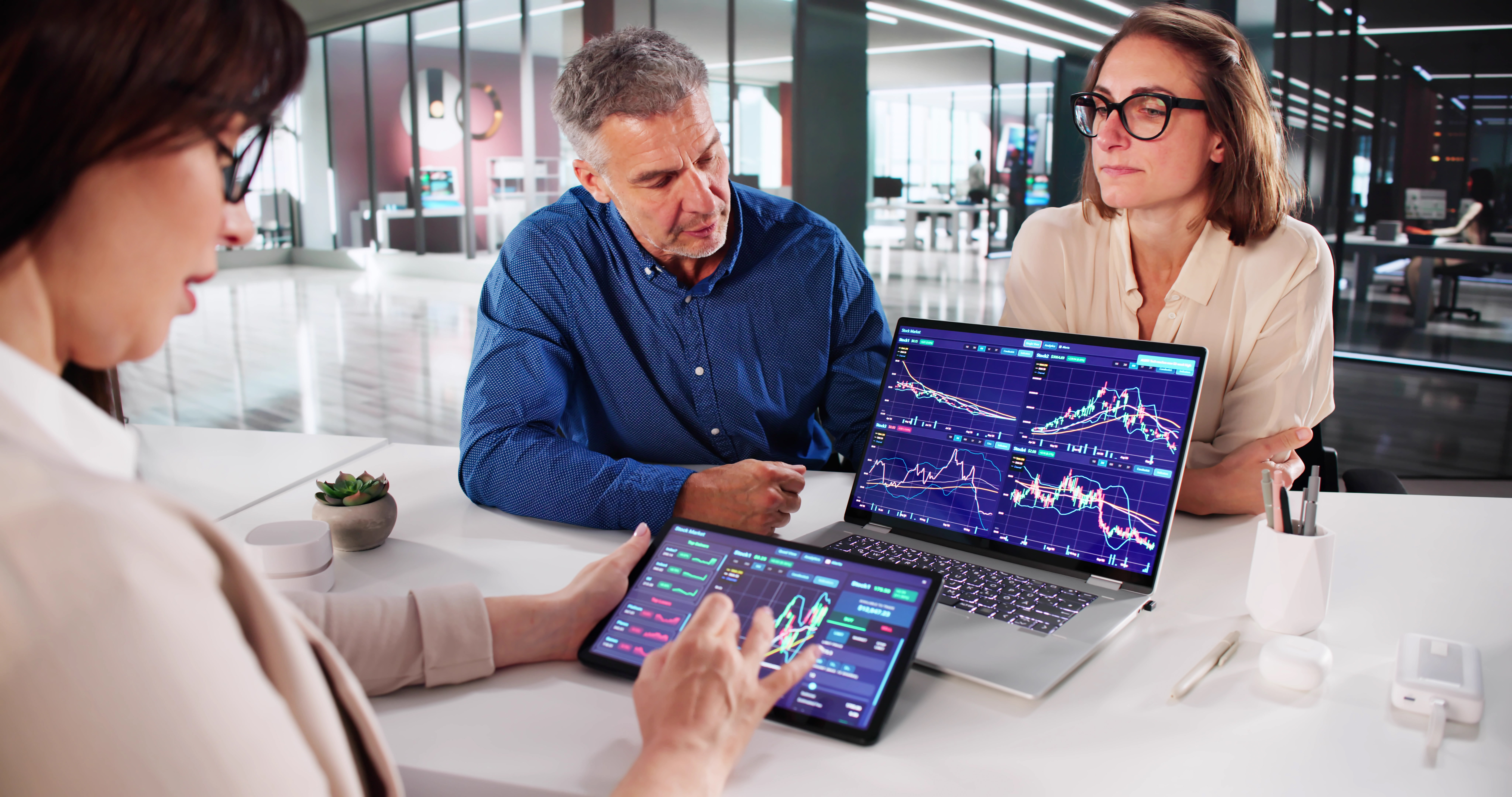 Proficient Stock Exchange Analyst Reviewing Market Trends With Senior Broker